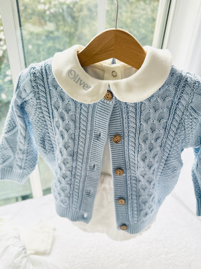 Baby outfit with blue cardigan, round collar bodysuit and white linen bloomers and long socks