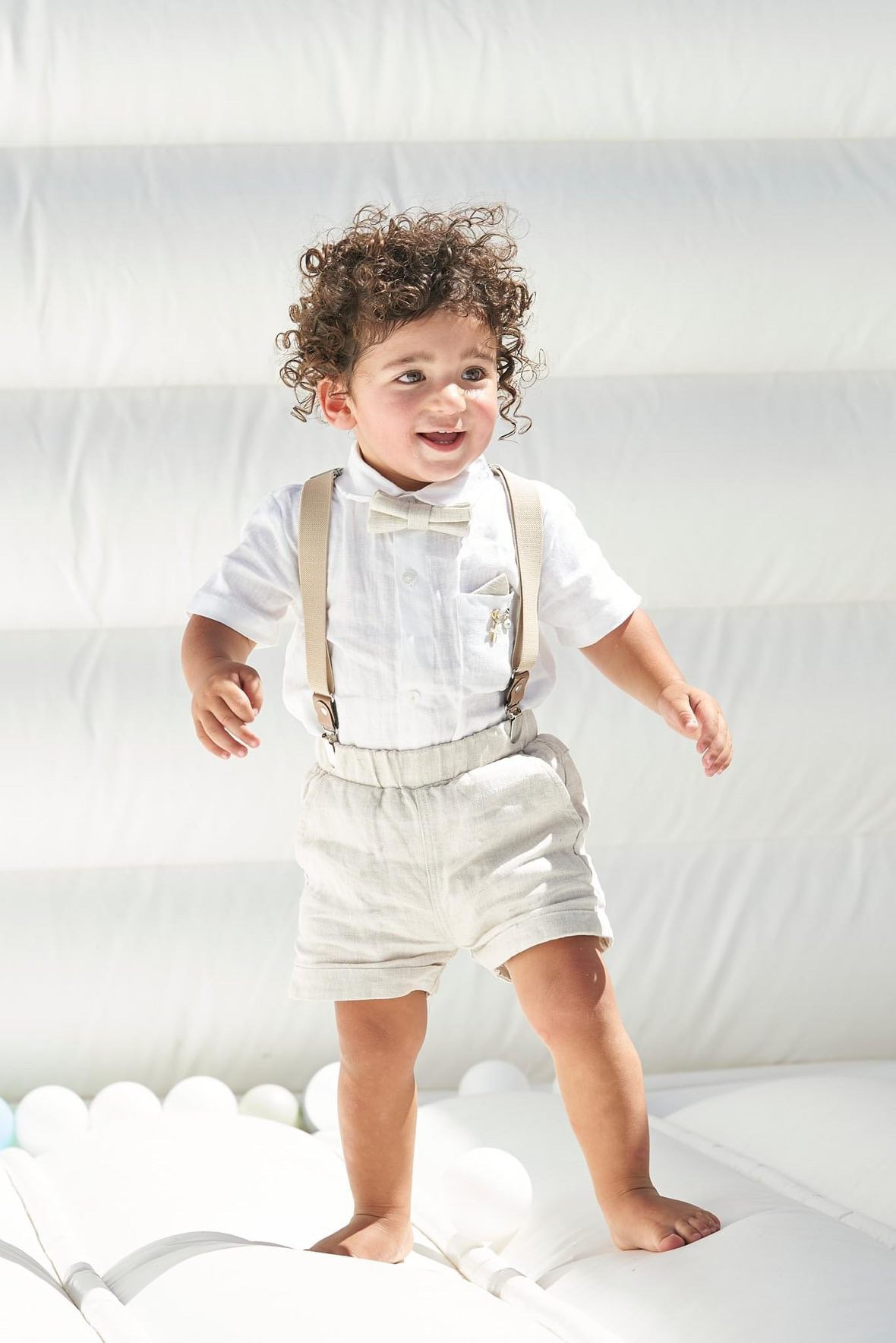 Beige linen summer set with shorts, shirt, suspenders and bow tie plus optional extras