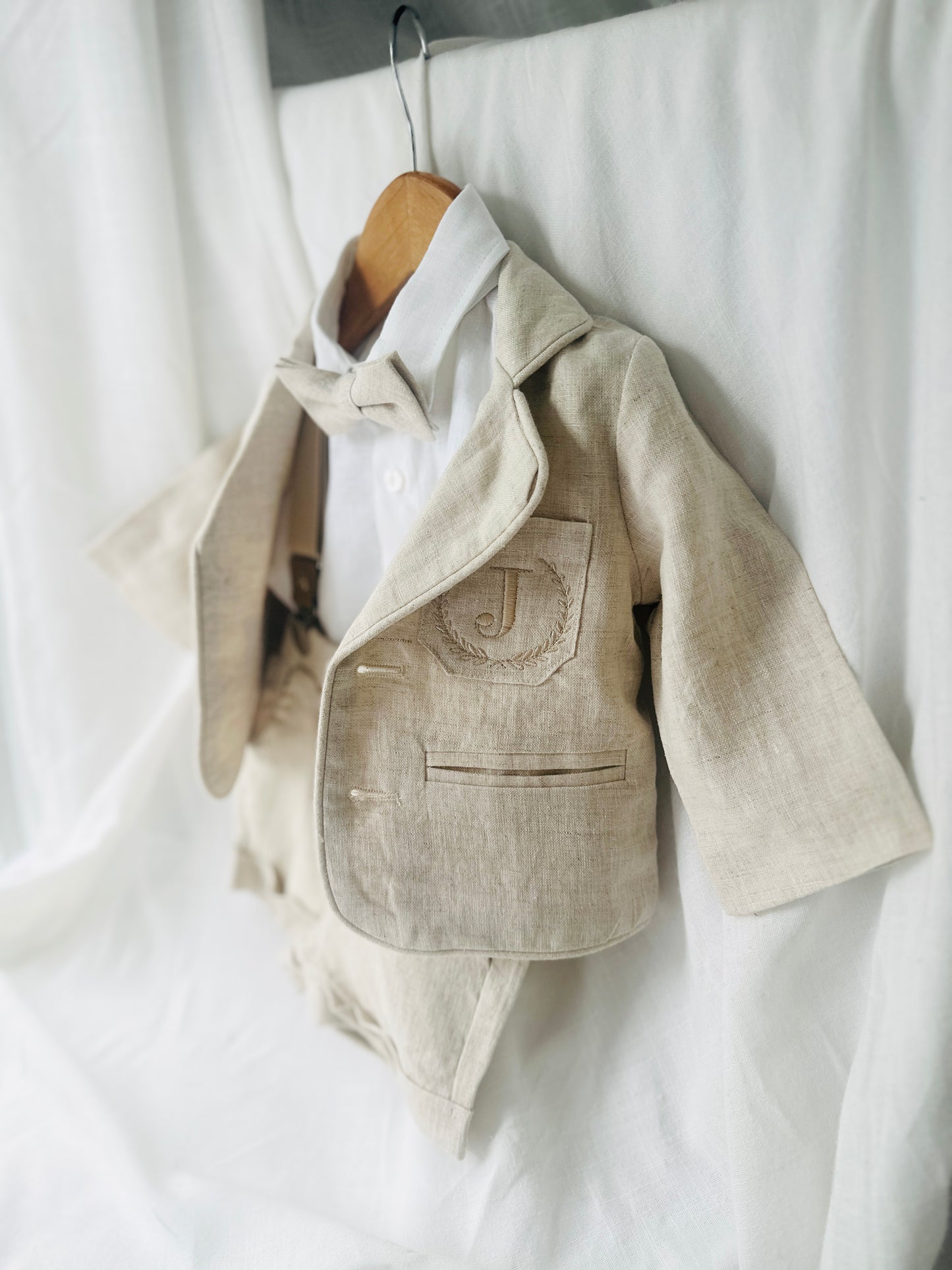 Beige Linen Baptism outfit with suspender shorts, shirt, and bow tie plus optional jacket and embroidery