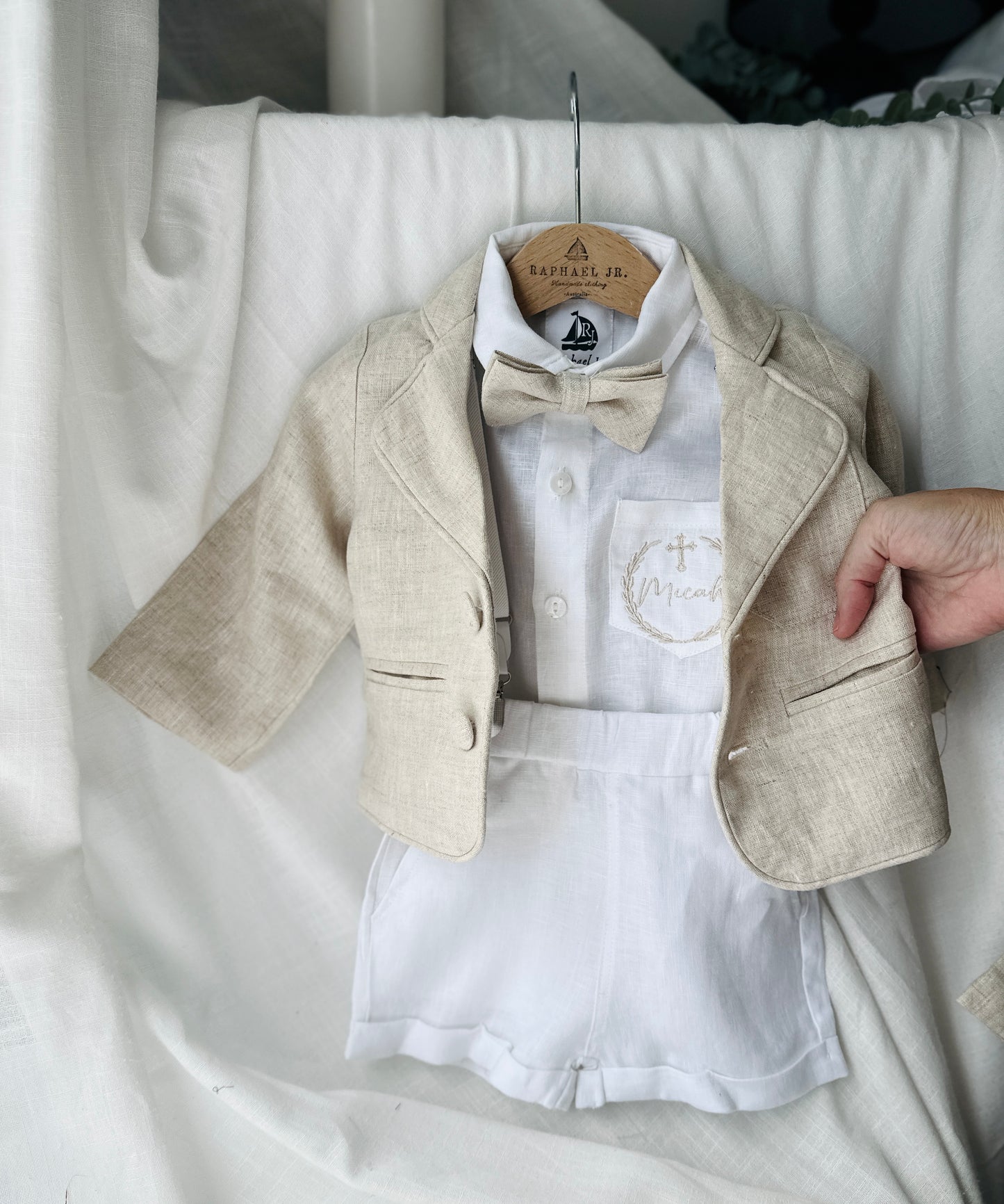 White and beige Summer linen outfit with suspender shorts, shirt, and bow tie plus optional jacket and embroidery