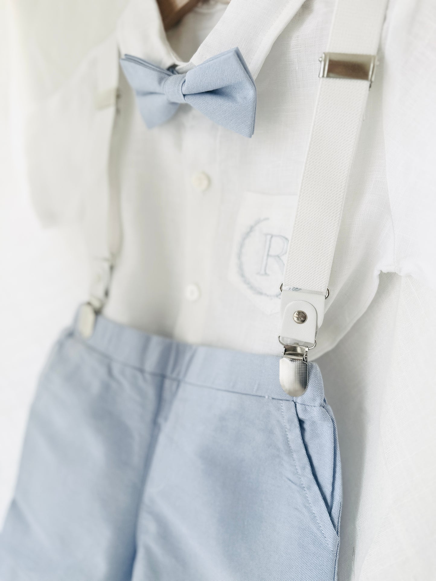 Blue chambray set with blue pants, white linen shirt, white, blue or beige suspenders and blue bow tie