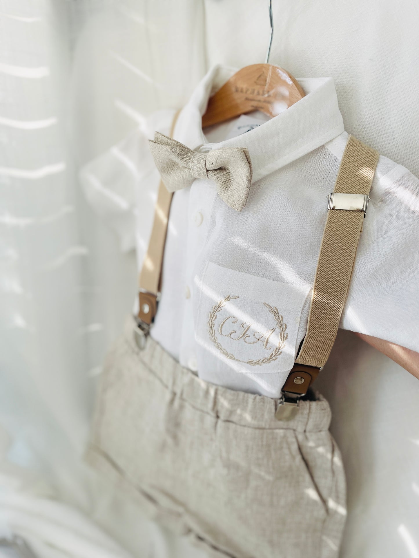 Beige Linen Baptism outfit with suspender shorts, shirt, and bow tie plus optional jacket and embroidery