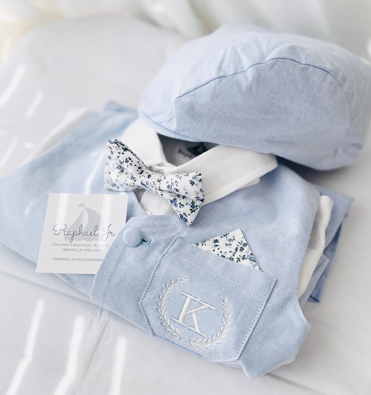 Baby and Toddler Boys pale blue chambray set with vest, pants, linen shirt, bowtie and suspenders, plus optional jacket cap and shoes