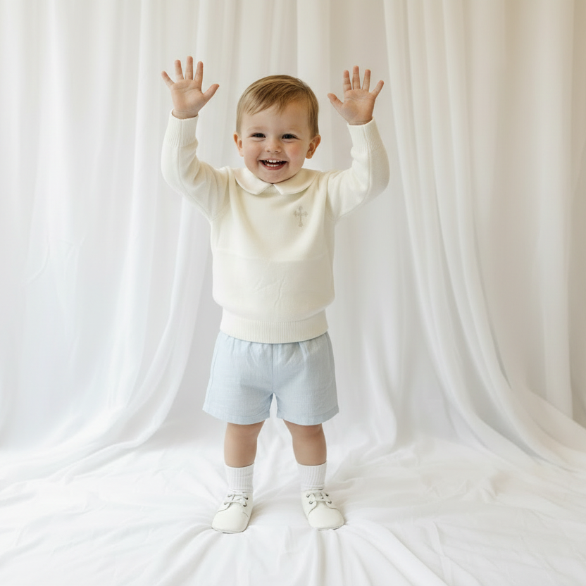 Baptism outfit with cotton onesie and jumper and pale blue shorts and long socks