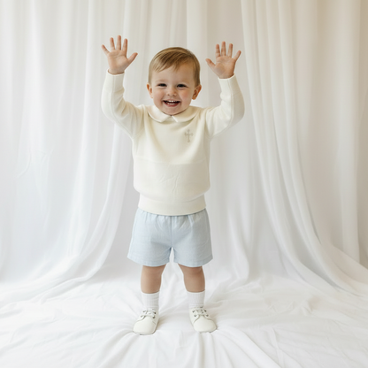 Baptism outfit with cotton onesie and jumper and pale blue shorts and long socks