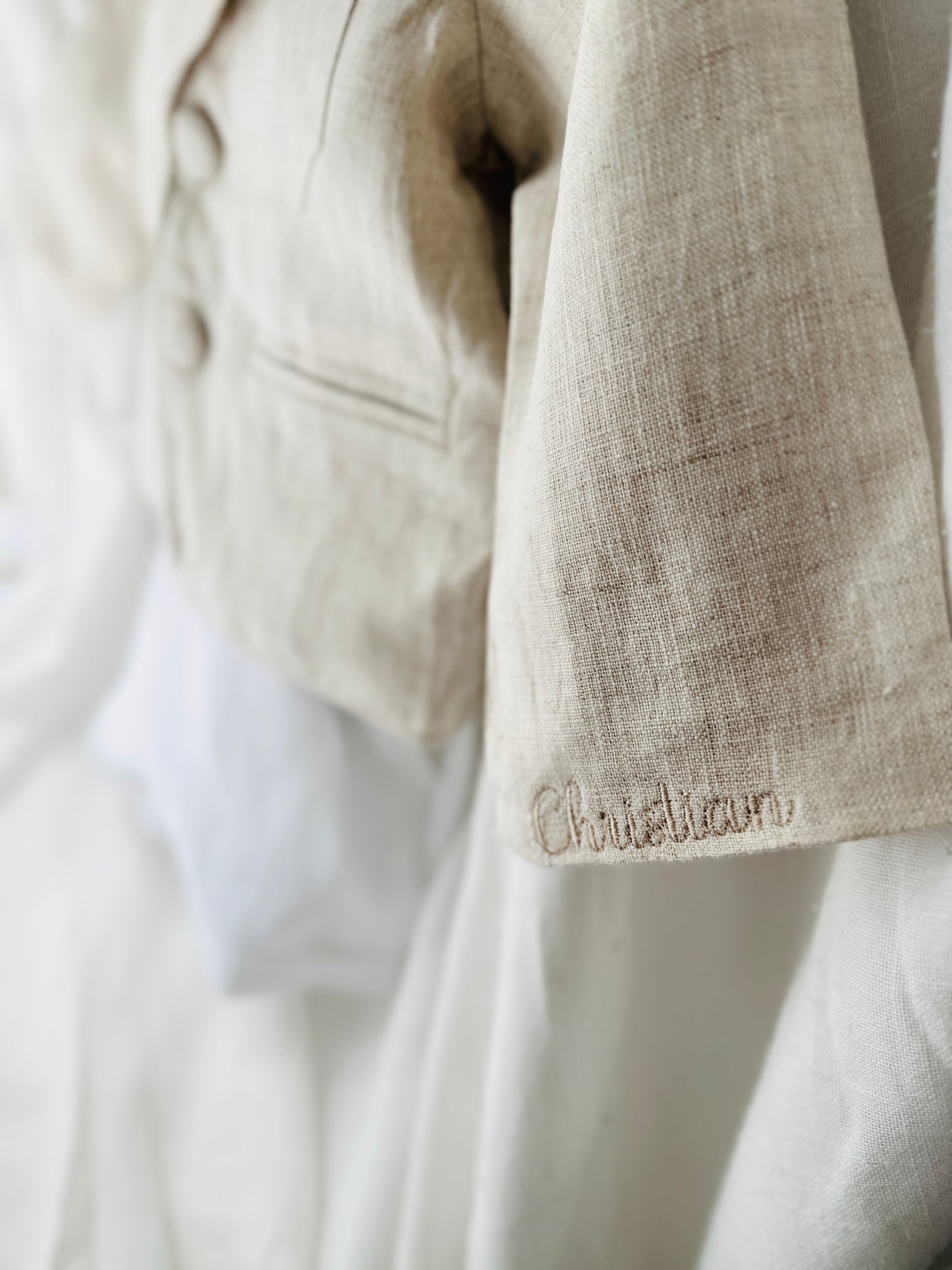 White and beige Summer linen outfit with suspender shorts, shirt, and bow tie plus optional jacket and embroidery