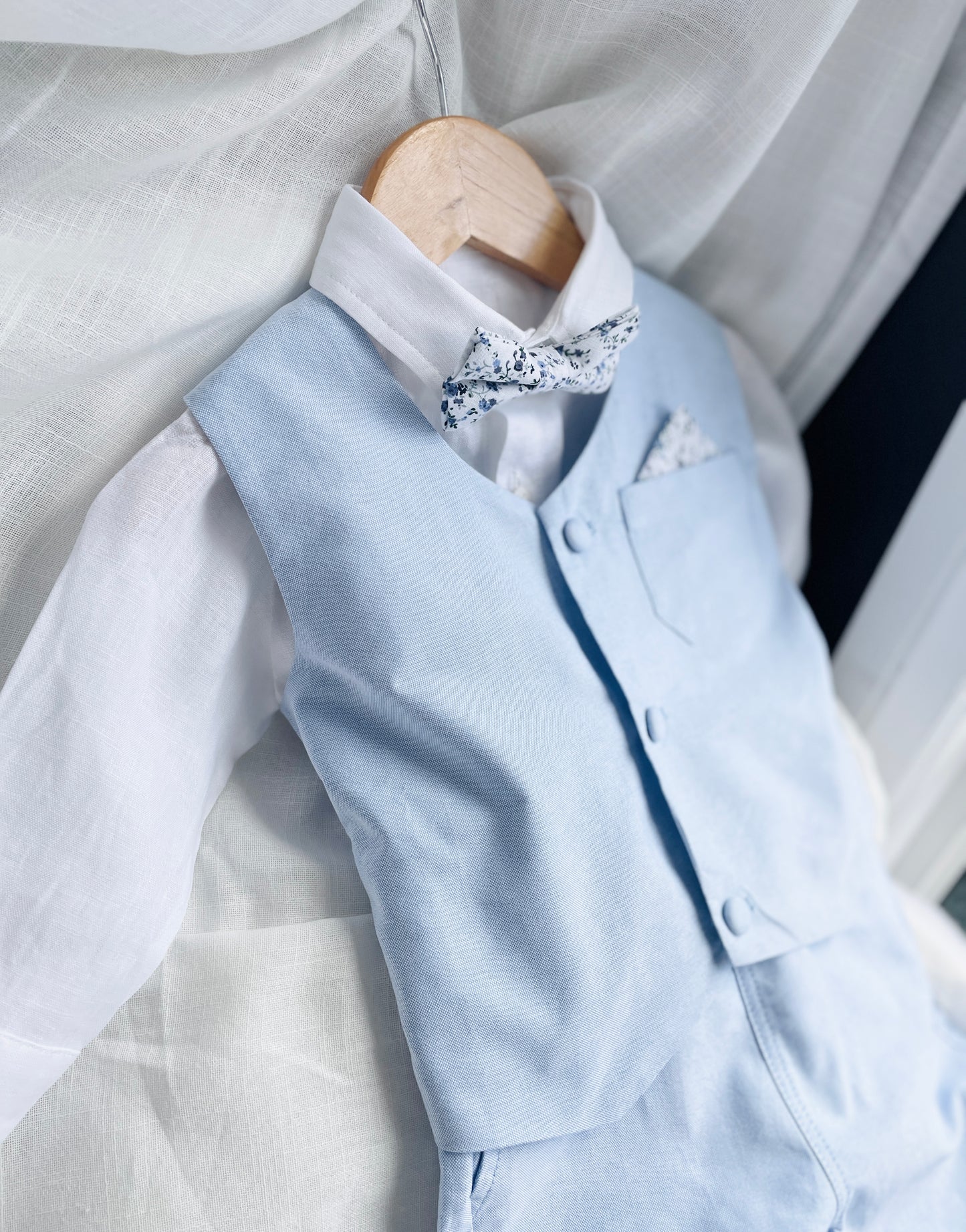 Baby and Toddler Boys pale blue chambray set with vest, pants, linen shirt, bowtie and suspenders, plus optional jacket cap and shoes