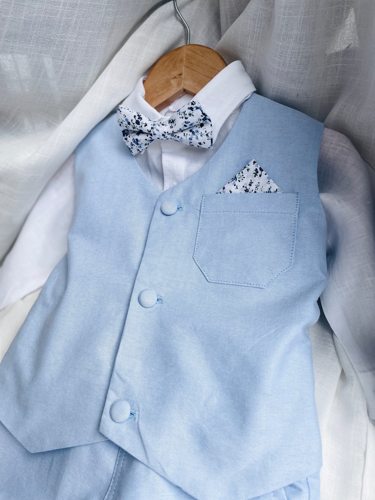 Baby and Toddler Boys pale blue chambray set with vest, pants, linen shirt, bowtie and suspenders, plus optional jacket cap and shoes