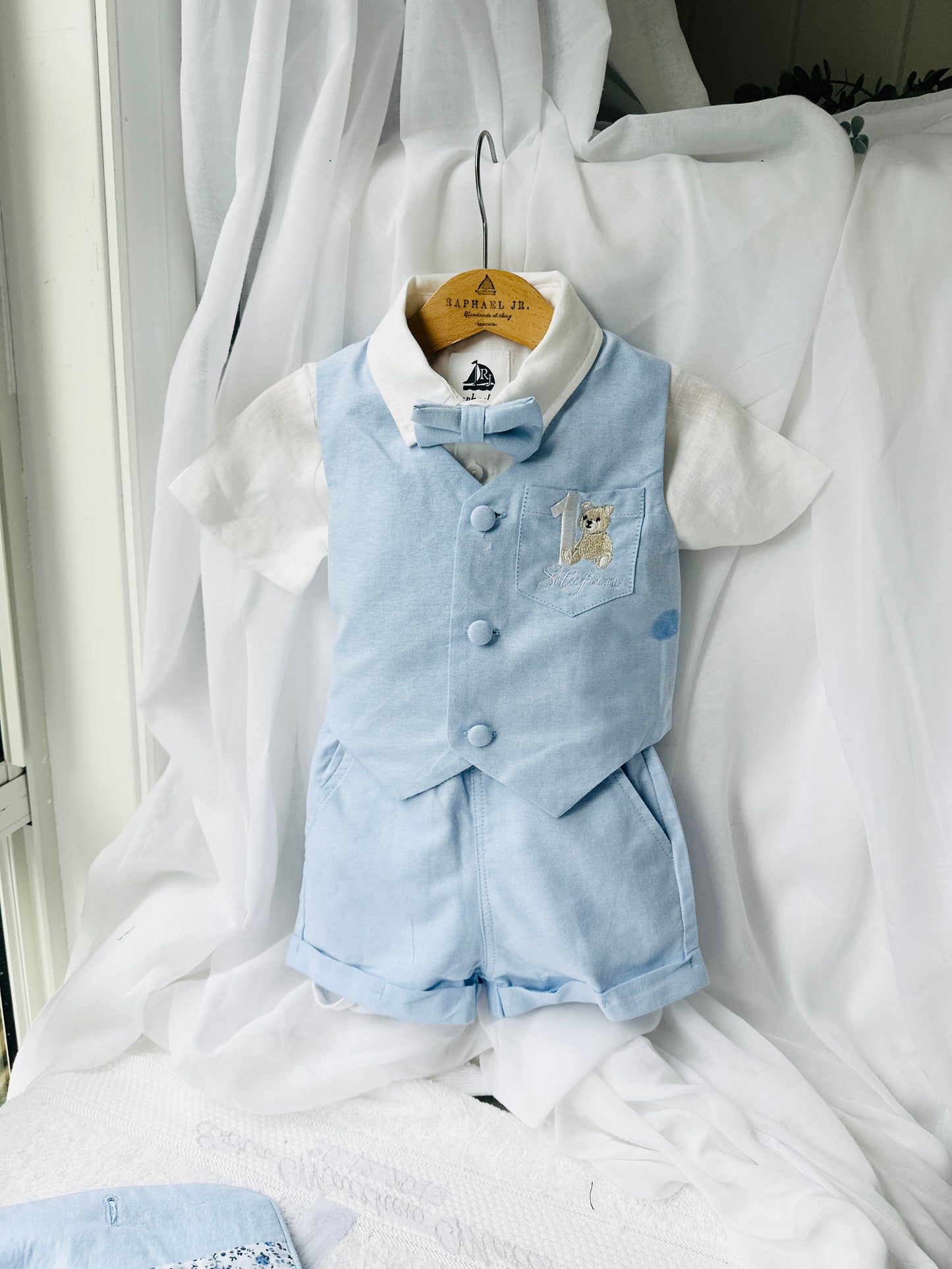 Pale blue summer vest set with blue vest, suspender shorts white shirt and bowtie