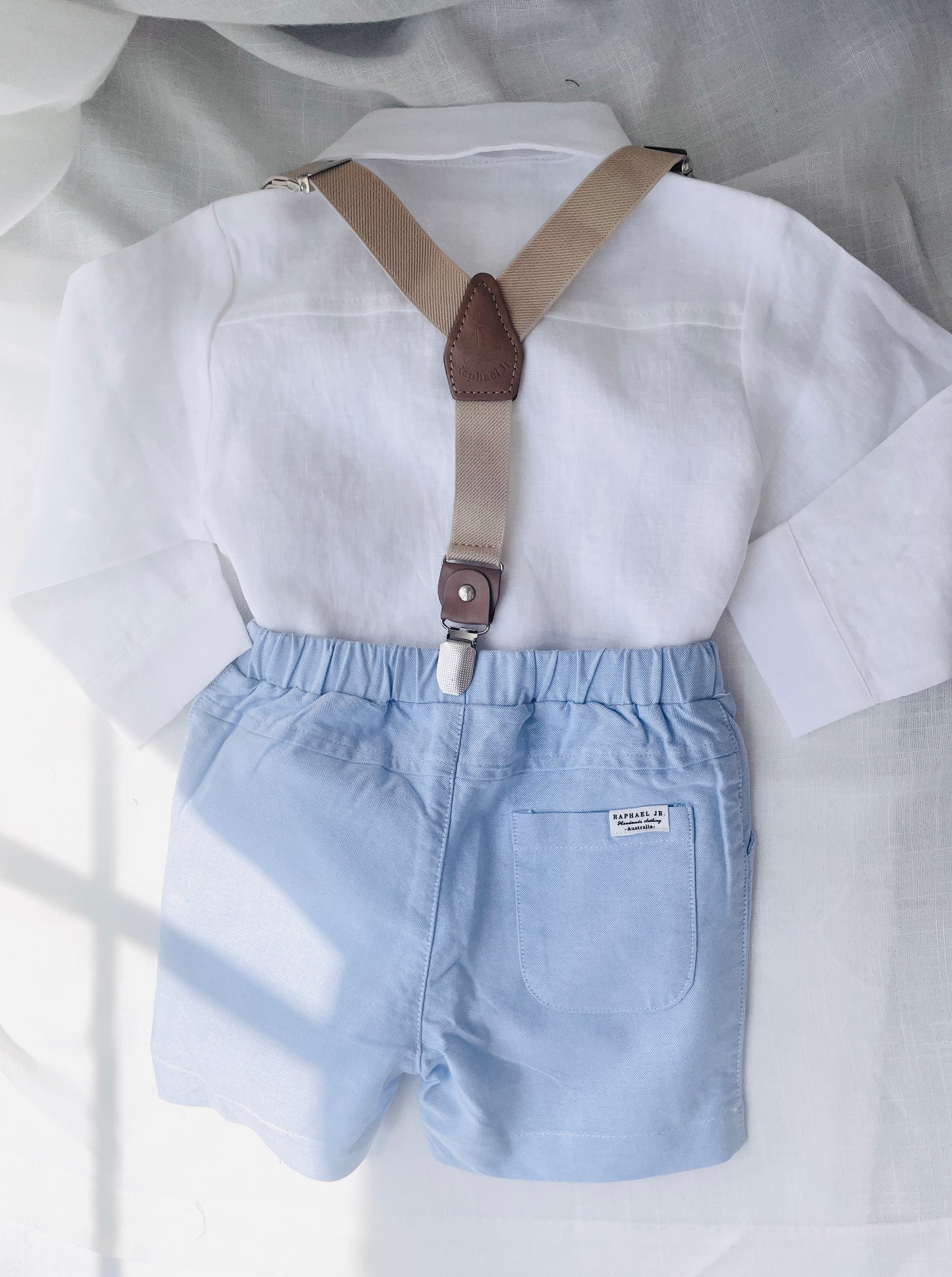 pale blue chambray summer first birthday set with shorts, shirt, suspenders and bow tie plus optional extras