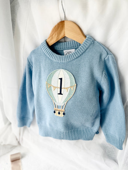 Pale blue teddy or hot air balloon jumper knit