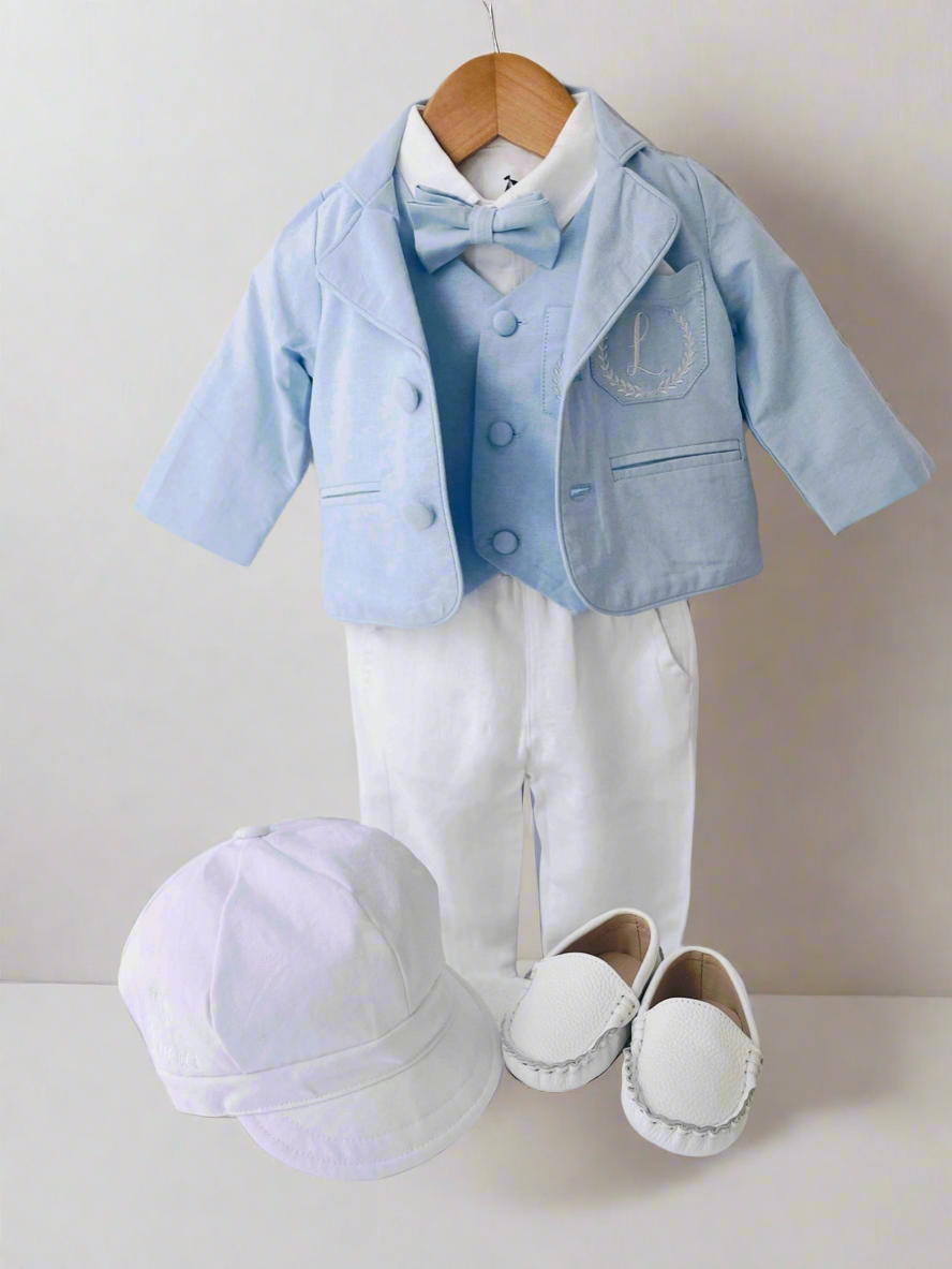 Light blue and white suit set with blue vest, bow tie and jacket, white linen pants, suspenders and shirt
