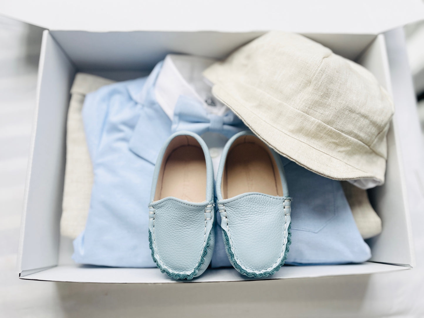 pale blue chambray summer first birthday set with shorts, shirt, suspenders and bow tie plus optional extras